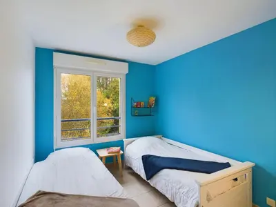 Un ou plusieurs lits dans un hébergement de l'établissement Pont L'Abbé - Appartement pour 4 avec balcon
