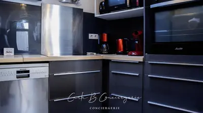 Cuisine ou kitchenette dans l'établissement MAISON LE BONHEUR Concarneau 4 personnes