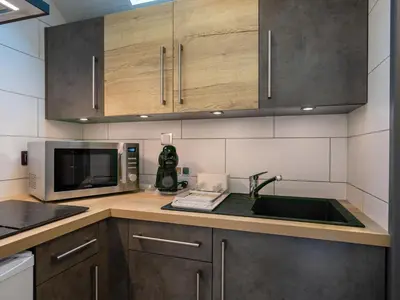 Cuisine ou kitchenette dans l'établissement Holiday Home Ti Bihan by Interhome
