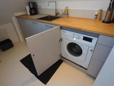 Cuisine ou kitchenette dans l'établissement Maison Le Rose