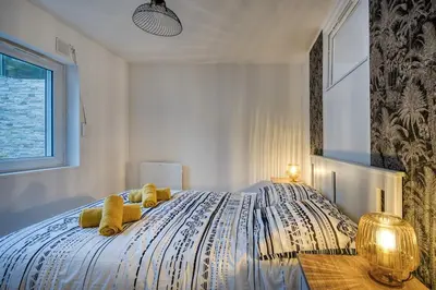 Un ou plusieurs lits dans un hébergement de l'établissement Alicia - Appartement RDC - Parking gratuit