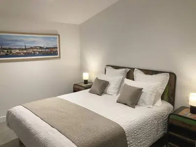 Un ou plusieurs lits dans un hébergement de l'établissement Kervéo vue sur mer - Gîte, spa et sauna