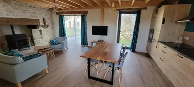 Télévision ou salle de divertissement dans l'établissement Gîte 