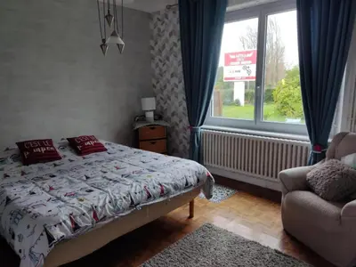 Un ou plusieurs lits dans un hébergement de l'établissement apartement avec parking prive