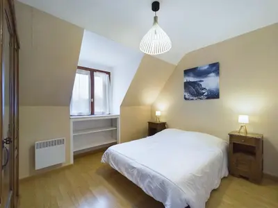 Un ou plusieurs lits dans un hébergement de l'établissement Maison idéale pour familles - Grand jardin