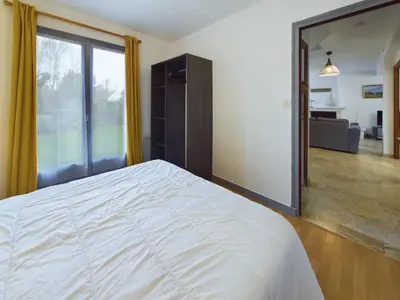 Un ou plusieurs lits dans un hébergement de l'établissement Maison idéale pour familles - Grand jardin