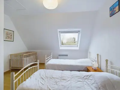Un ou plusieurs lits dans un hébergement de l'établissement Maison idéale pour familles - Grand jardin