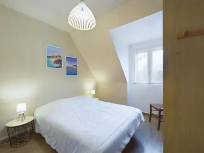 Un ou plusieurs lits dans un hébergement de l'établissement Maison idéale pour familles - Grand jardin