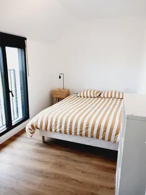 Un ou plusieurs lits dans un hébergement de l'établissement Jolie maison contemporaine proche plage