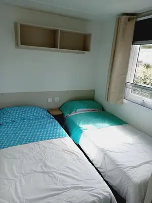 Un ou plusieurs lits dans un hébergement de l'établissement Mobil HOME 40 m2 3CH