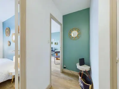 Un ou plusieurs lits dans un hébergement de l'établissement À 110 m de la plage, appartement moderne pour 4