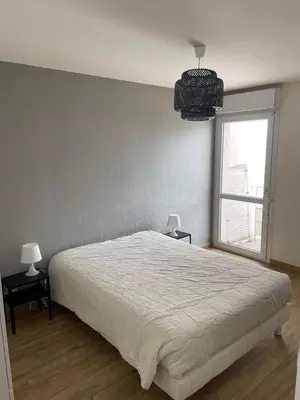 Un ou plusieurs lits dans un hébergement de l'établissement Appartement lumineux vue mer