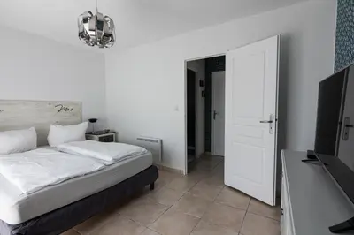 Un ou plusieurs lits dans un hébergement de l'établissement Villa DUXCAAR