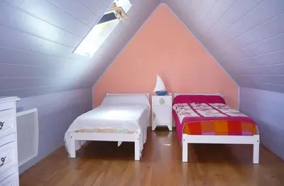 Un ou plusieurs lits dans un hébergement de l'établissement Maison de la plage avec Piscine - Breizh Location