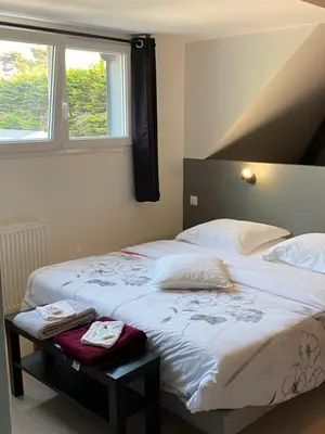 Un ou plusieurs lits dans un hébergement de l'établissement Natural green villa 15 personnes