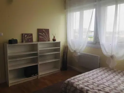 Un ou plusieurs lits dans un hébergement de l'établissement Cozy'Maisonnette 5Chb Brest Guip