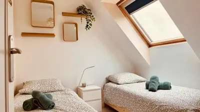 Un ou plusieurs lits dans un hébergement de l'établissement Cozy'Maisonnette 5Chb Brest Guip