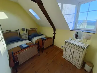 Un ou plusieurs lits dans un hébergement de l'établissement Gite Petite Florence