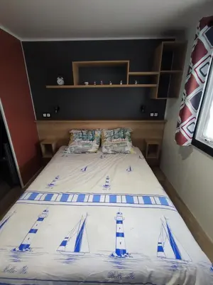Un ou plusieurs lits dans un hébergement de l'établissement Mobil home