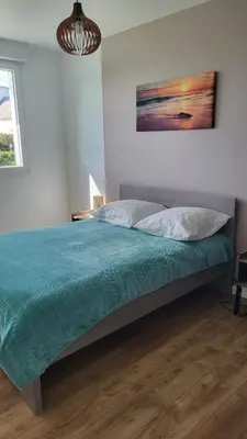 Un ou plusieurs lits dans un hébergement de l'établissement Maison le dauphin Kerlouan