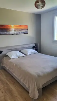 Un ou plusieurs lits dans un hébergement de l'établissement Maison le dauphin Kerlouan