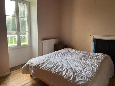 Un ou plusieurs lits dans un hébergement de l'établissement Grande Maison de Campagne proche de Carhaix
