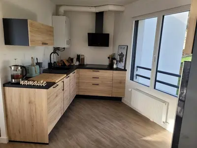 Cuisine ou kitchenette dans l'établissement T2 récent, tout équipé et bel extérieur