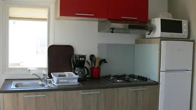 Cuisine ou kitchenette dans l'établissement Camping Lizoé