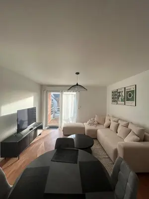Coin salon dans l'établissement Appartement chaleureux proche du centre et de la plage