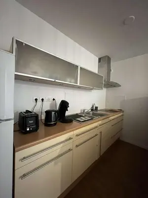 Cuisine ou kitchenette dans l'établissement Appartement chaleureux proche du centre et de la plage