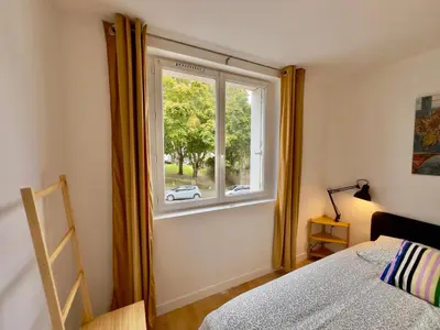 Un ou plusieurs lits dans un hébergement de l'établissement Appartement central proche Base Navale et Siam
