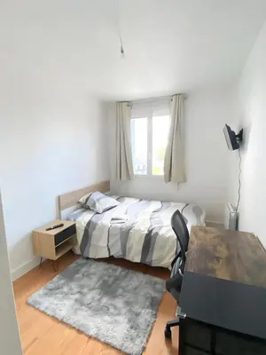 Un ou plusieurs lits dans un hébergement de l'établissement Appartement proche centre-ville