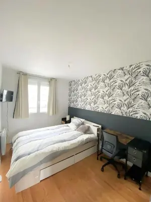 Un ou plusieurs lits dans un hébergement de l'établissement Appartement proche centre-ville