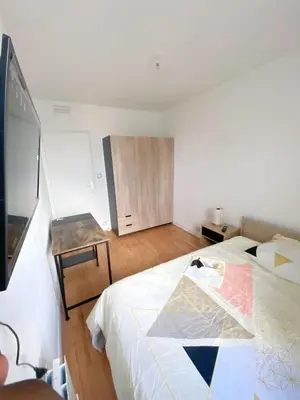 Un ou plusieurs lits dans un hébergement de l'établissement Appartement proche centre-ville