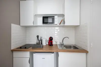 Cuisine ou kitchenette dans l'établissement Louzou