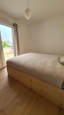 Un ou plusieurs lits dans un hébergement de l'établissement Maison Cerisier