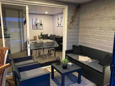 Coin salon dans l'établissement Mobil Home piscine chauffée Pont l 'Abbe