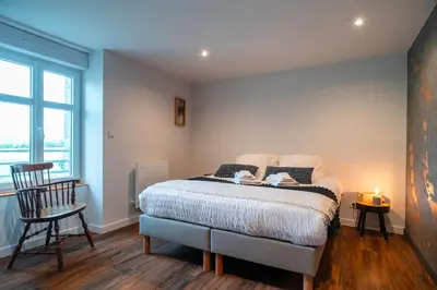 Un ou plusieurs lits dans un hébergement de l'établissement Maison spacieuse a 20 minutes de mer