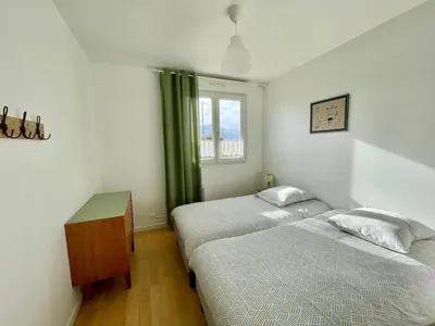 Un ou plusieurs lits dans un hébergement de l'établissement Maison de la plage Santec