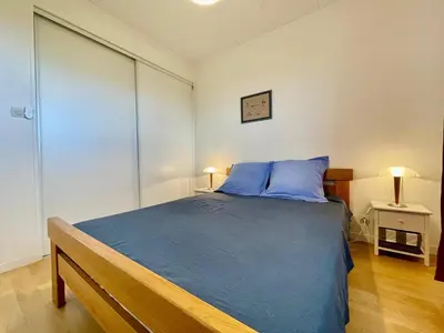 Un ou plusieurs lits dans un hébergement de l'établissement Maison de la plage Santec