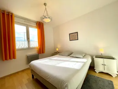 Un ou plusieurs lits dans un hébergement de l'établissement Maison de la plage Santec