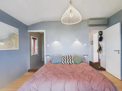 Un ou plusieurs lits dans un hébergement de l'établissement Superbe villa à Plouguerneau les pieds dans l'eau