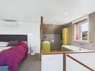 Un ou plusieurs lits dans un hébergement de l'établissement Superbe villa à Plouguerneau les pieds dans l'eau