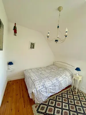Un ou plusieurs lits dans un hébergement de l'établissement Maison aux camélias