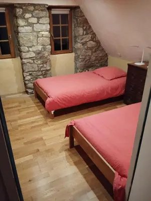 Un ou plusieurs lits dans un hébergement de l'établissement Maison du manoir