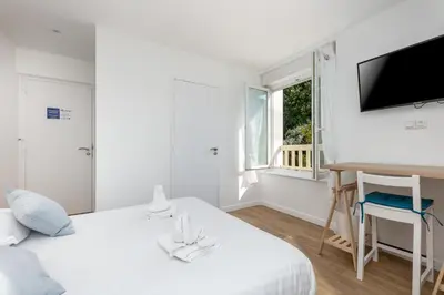 Un ou plusieurs lits dans un hébergement de l'établissement Chambre indépendante Etoile