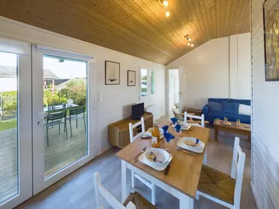 Coin salon dans l'établissement Chalet pour 4 dans une résidence avec piscine