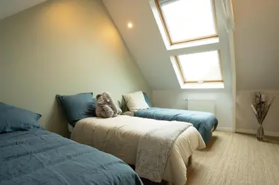 Un ou plusieurs lits dans un hébergement de l'établissement Villa Ty Amor - avec grand jardin et jacuzzi pour 9