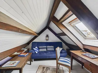 Coin salon dans l'établissement Charmante maison en pierre - vue sur l'océan