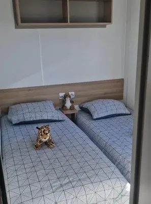 Un ou plusieurs lits dans un hébergement de l'établissement Mobilhome chaleureux
